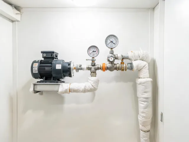 Hot water recirculation pump and mixing valve assembly