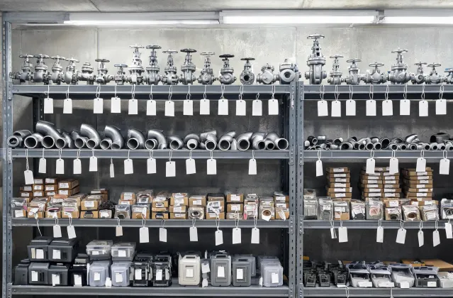 MRO storeroom with tagged valves and pump parts